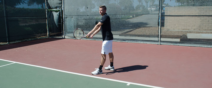 A photograph showing the proper tennis serve stance